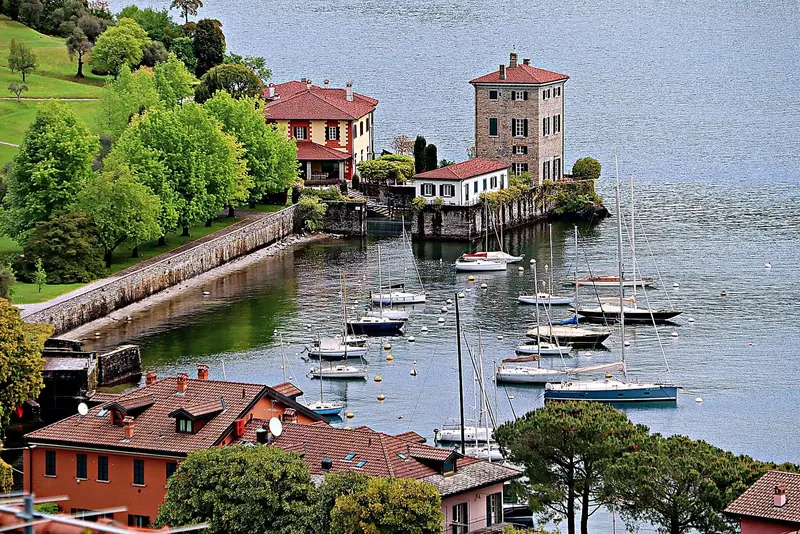 The Porto di Pescallo at Bellagio, on Lake Como's southern promontory, where sailboats moor below the villas lining the point.