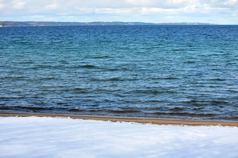 The West Arm of Grand Traverse Bay off Traverse City, water clear enough that local marketing calls it the Caribbean of the Midwest.