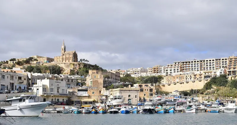Mgarr harbour on Gozo, the only berthing on the second island, working ferry port and fishing fleet in the same basin.