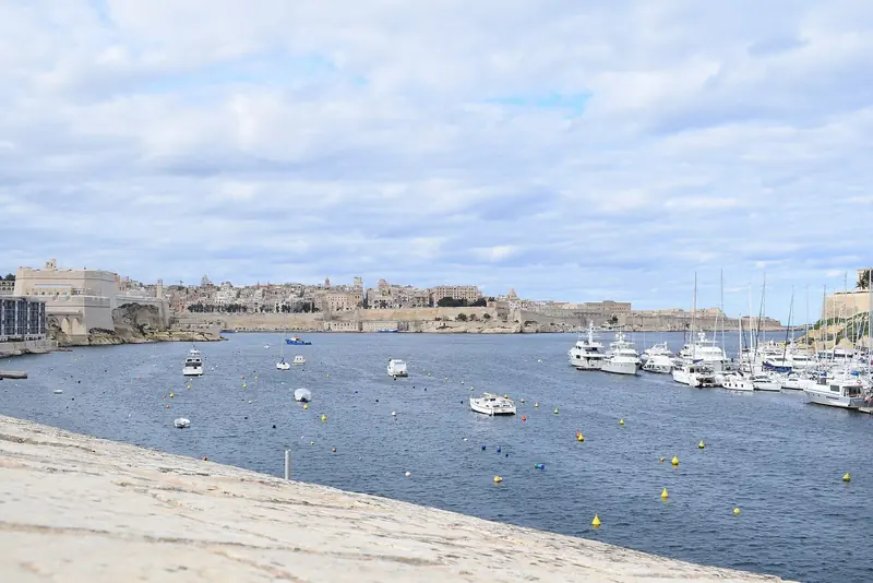 A creek off the Grand Harbour with moorings across it, showing how the harbour divides into sheltered basins behind the fortifications.