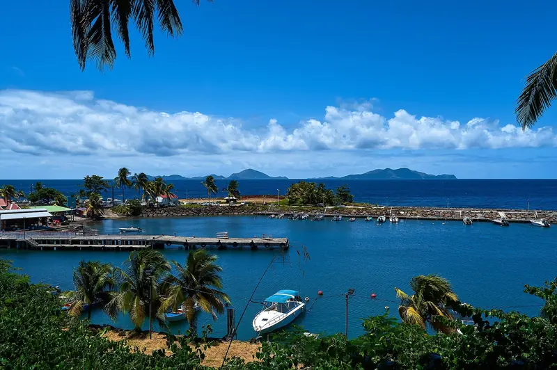 The Saintes archipelago rises from the sea as seen from the small port of Trois-Rivieres on Basse-Terre, Guadeloupe.