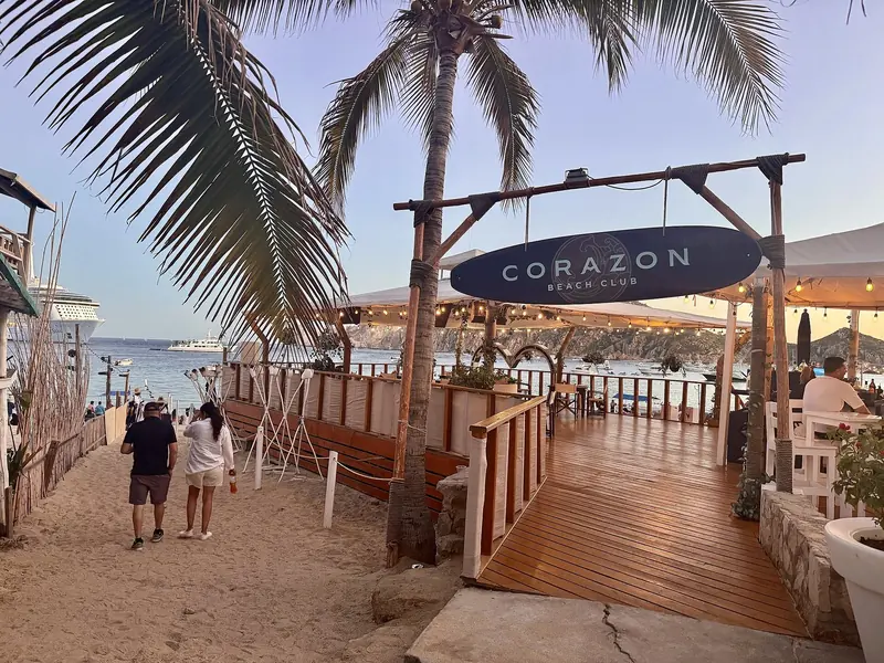 Corazon Beach Club on Medano Beach, the kind of beach-club anchorage stop that has become as much a part of a Cabo day as the marina itself.