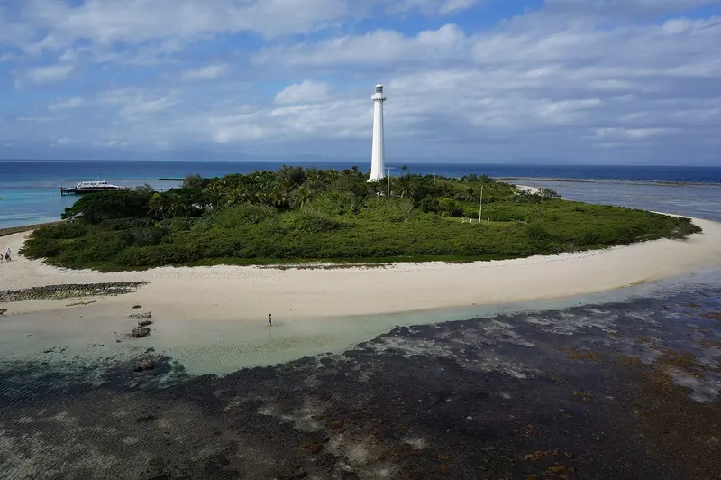 The Amedee lighthouse stands on its own islet at the southern entrance to the Noumea lagoon, the tallest metal lighthouse in the world and the landmark every yacht bound for the barrier reef passage uses to find the channel.
