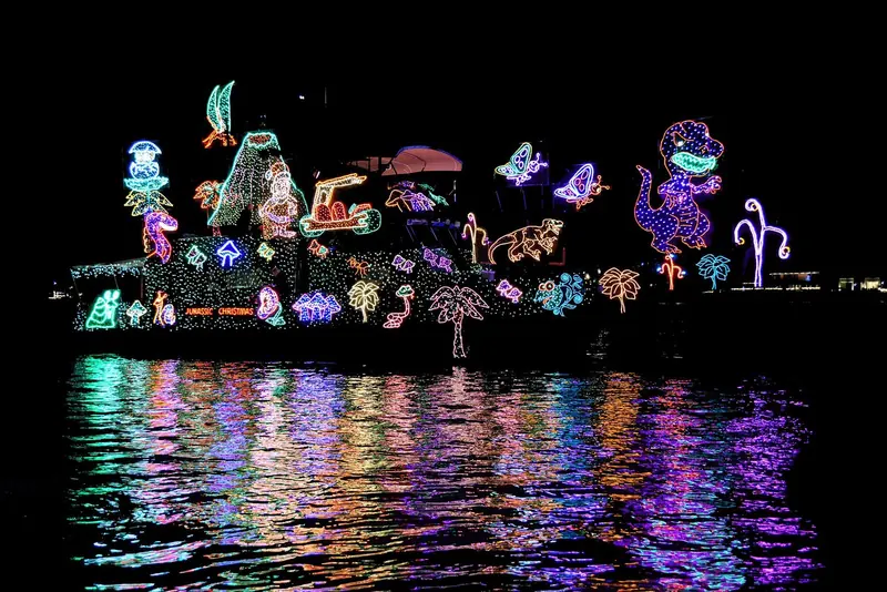 An illuminated entry in the Newport Beach Christmas Boat Parade, the harbor's own tradition since 1908.