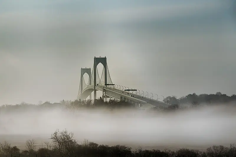 Fog rolling through the East Passage under the Pell Bridge, the Atlantic weather that can close Brenton Reef to a smaller boat with no notice.