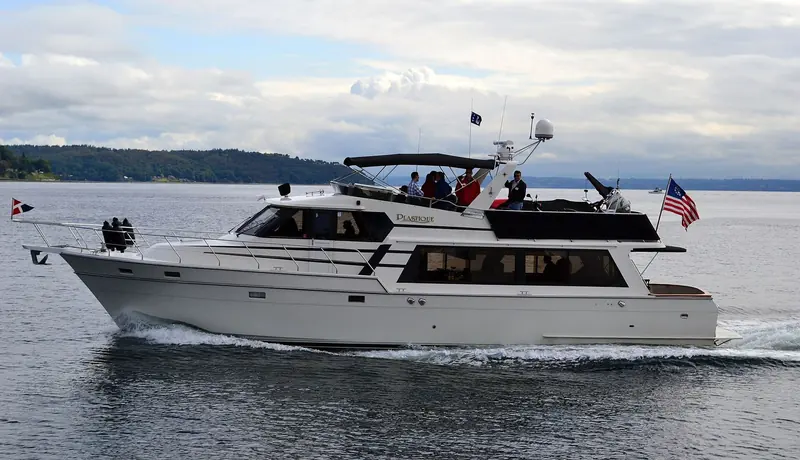 Classic Northwest motor yachts on an organised fleet cruise through the islands, the kind of cruising-in-company culture the San Juans are known for.