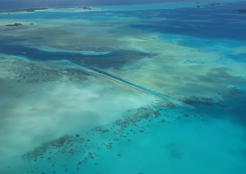 German Channel, dug through the barrier reef by German administrators in the early 1900s, is the working cut that lets deep-draught vessels pass from the lagoon to open Pacific water without the day's tide dictating the crossing.
