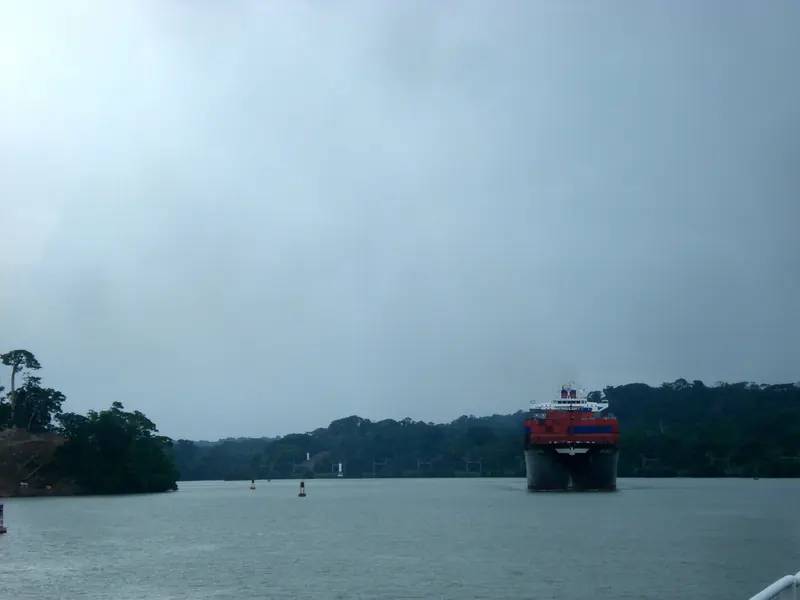 A ship on Gatun Lake under rain, the fifty mile passage that separates the Caribbean from the Pacific and takes a yacht most of a day.