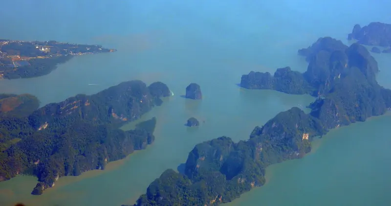Phang Nga Bay from the air, several hundred limestone towers standing in water that is mostly under twenty metres deep.