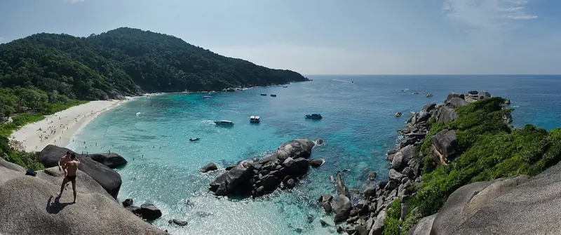 Granite boulders and clear water in the Similan islands, where a private yacht needs a permit issued only from the mainland park headquarters.