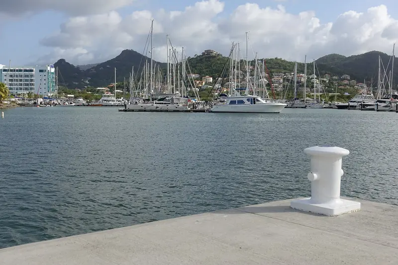 A mooring at Rodney Bay Marina, with the wider anchorage and hills behind.
