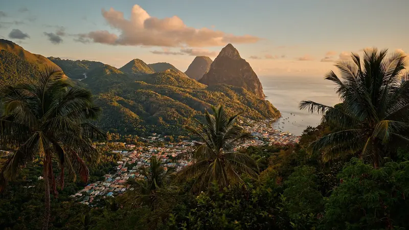 Soufriere at sunset with the Pitons rising behind the town.