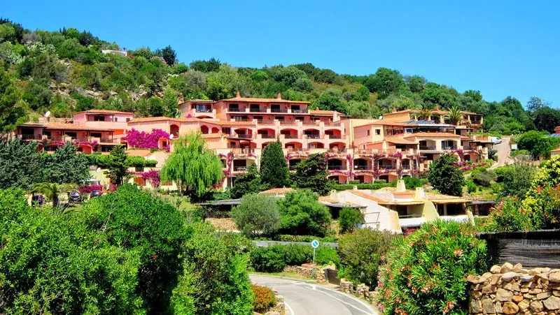 Porto Cervo village, low buildings in the Costa Smeralda style above the marina.