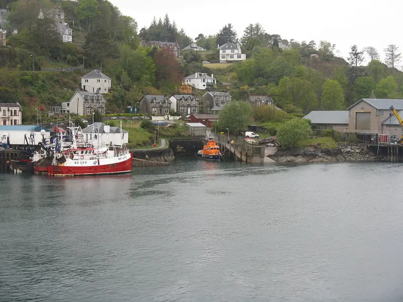 A small working harbour on the west coast, where a village pier and a handful of moorings are the whole of the infrastructure.