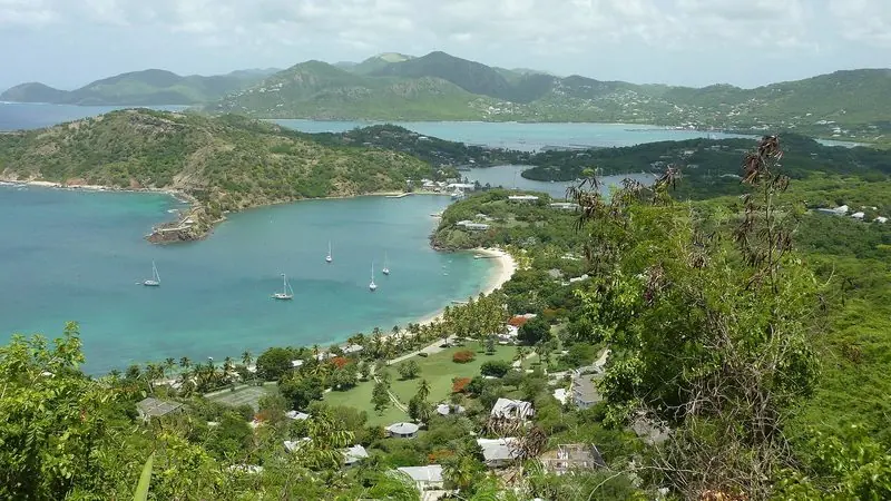 Falmouth Harbour and English Harbour lie either side of a low green isthmus on Antigua, both of them well sheltered and busy with yachts on moorings.