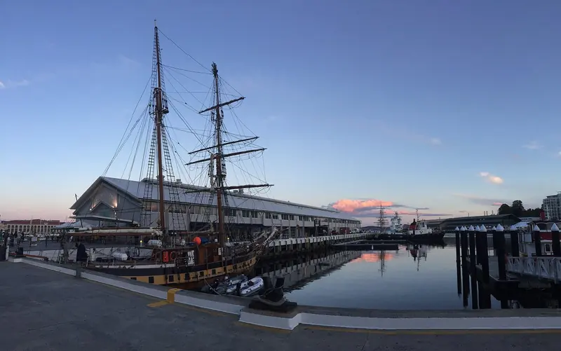 Hobart's waterfront on the Derwent, the working harbour a visiting yacht clears into before running south for the Channel.