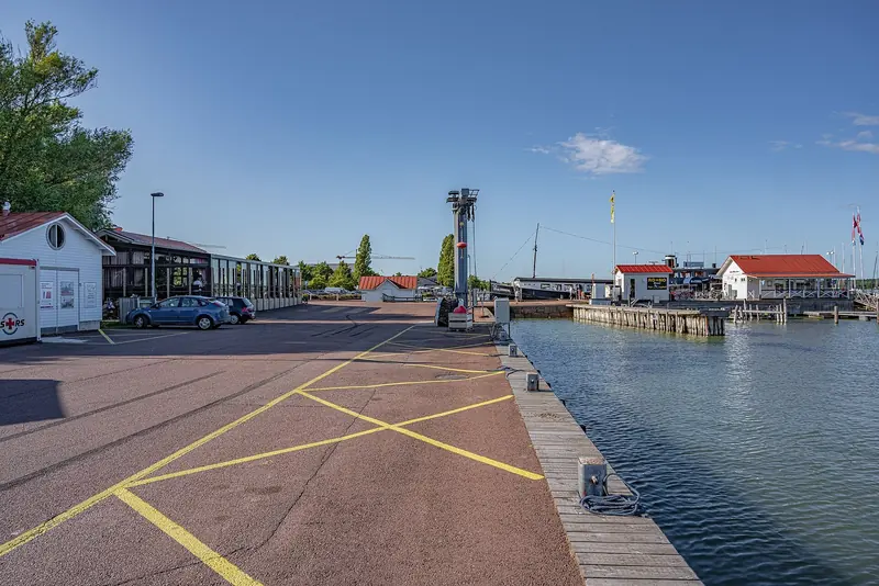 Boathouses, a fuel dock and moored yachts at Mariehamn's Osterhamn guest harbour, Aland Islands.