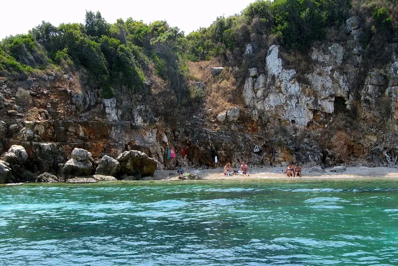 One of the Riviera's small pebble coves below the coastal cliffs, reachable mainly by boat or a scramble down from the road.