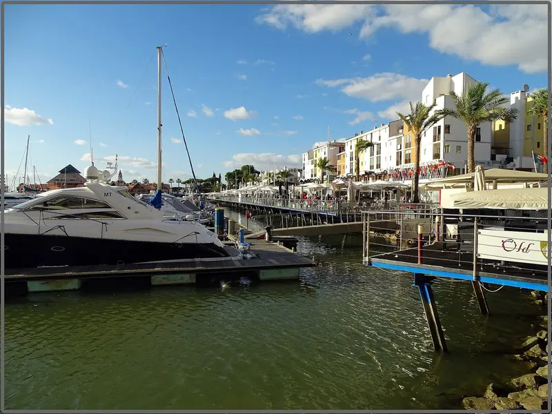 Motor yachts on the quay at Vilamoura, the largest marina in southern Portugal at 825 berths and the only one that publishes a price list.