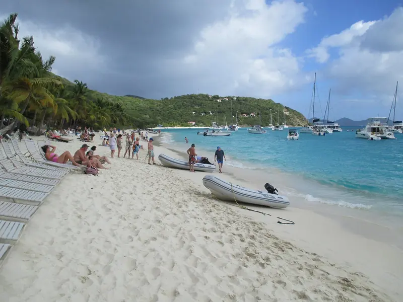 White Bay on Jost Van Dyke, a quarter mile of sand with the beach bars behind it and charter boats lying off in the turquoise.