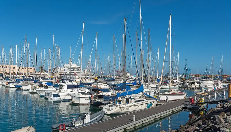Sailing yachts packed into a Canarian marina, the pattern from late October when the Atlantic crossing fleets gather.