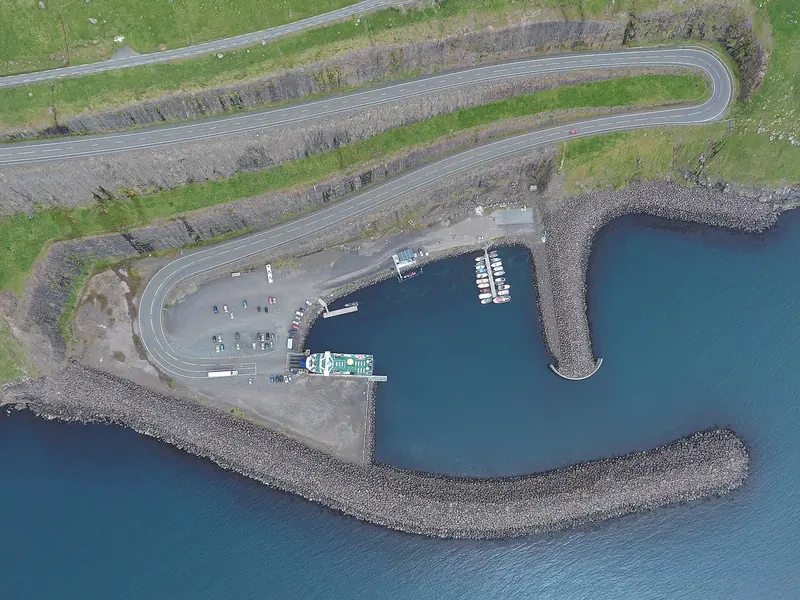 The harbour at Gamlartt, a small breakwater port that serves as a ferry landing and one of the few sheltered stops on Streymoy's west coast.