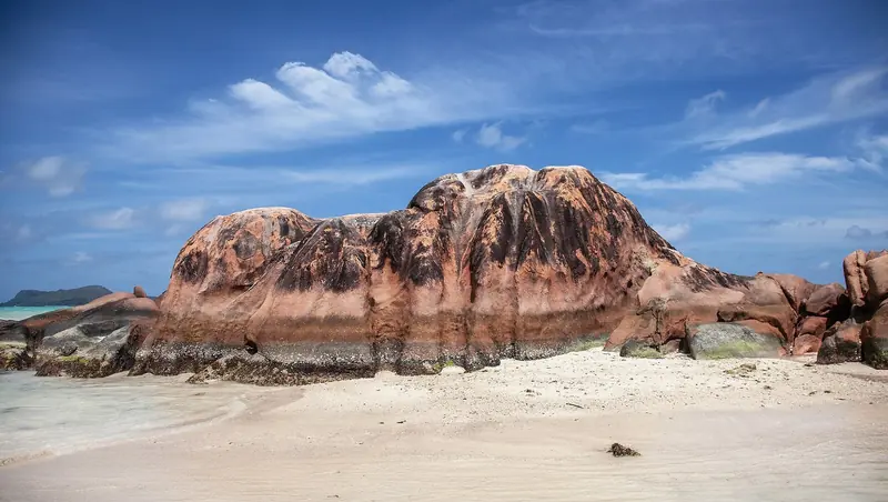 A single mass of weathered granite standing on the sand, the formation the inner islands are photographed for.