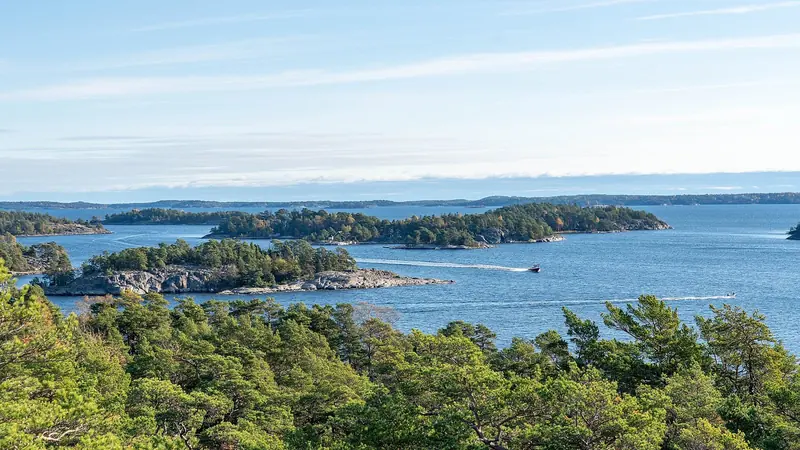 Wooded islands and bare skerries running out towards the open Baltic, part of an archipelago usually counted at about 30,000 of them.