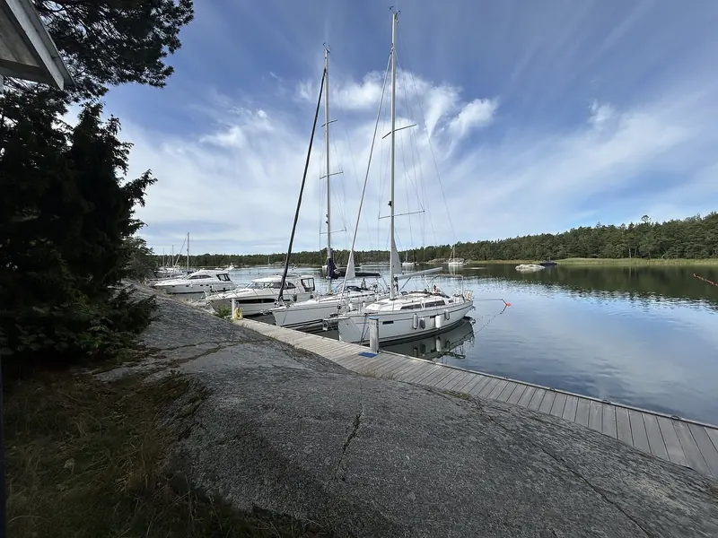 Sailing yachts alongside a jetty cut into the granite at the end of the day, with no tide to allow for and no swell to worry about.