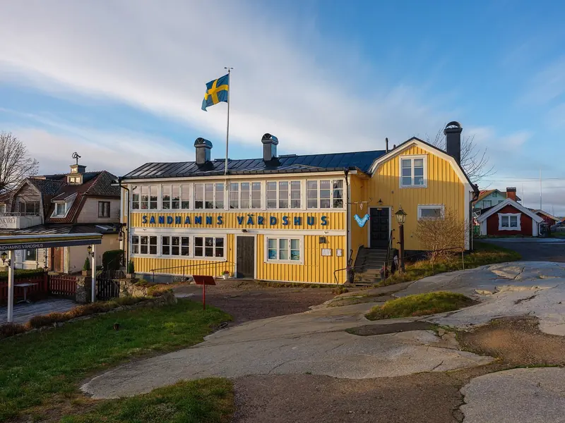 The old inn at Sandhamn on its granite slab, the shore side of an archipelago that runs on a jetty, a restaurant and a sauna.
