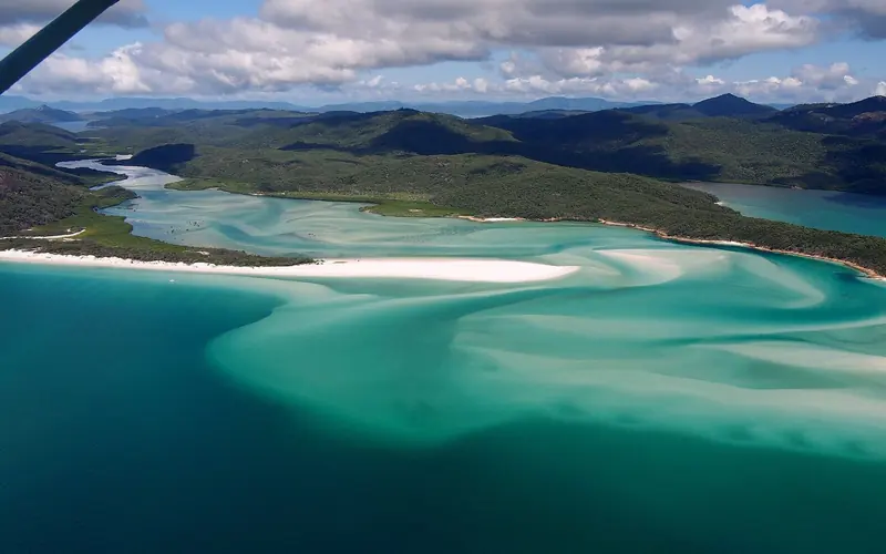 Hill Inlet at the northern end of Whitehaven Beach, where a three to four metre tidal range swirls the silica sand into the pattern the region is known for.