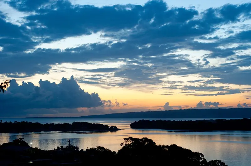 Sunset over Port Vila harbour, looking out toward Efate's outer bays where visiting yachts clear in.