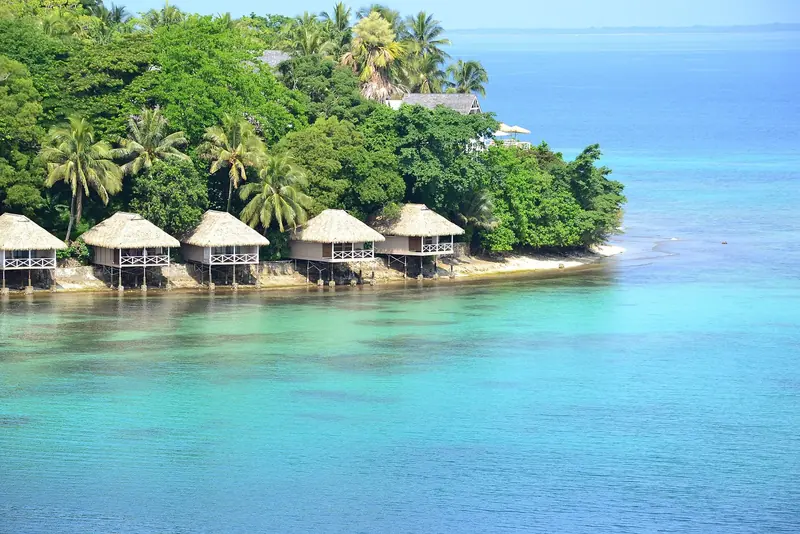 Overwater bungalows on Iririki Island, across the narrow channel from Port Vila's town waterfront and yacht moorings.