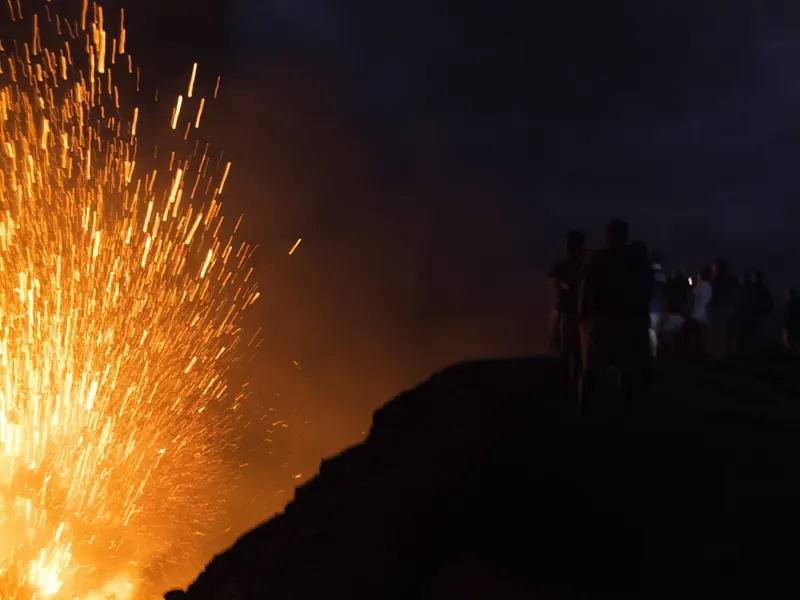 Mount Yasur erupting after dark on Tanna, the spectacle that draws yacht crews to anchor off the island.
