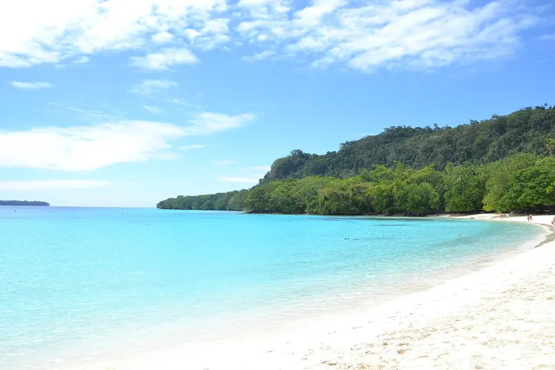 Champagne Beach on Espiritu Santo, the white-sand bay north of Luganville that regularly ranks among the South Pacific's best anchoring stops.