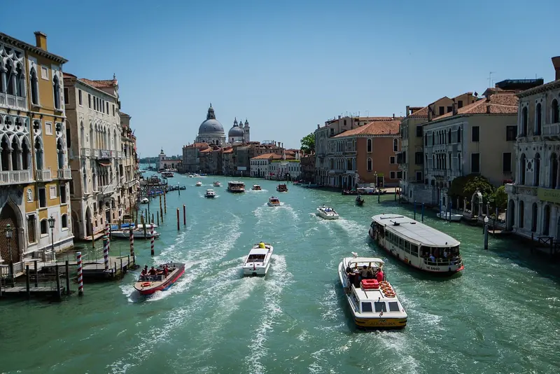 The Grand Canal on an ordinary afternoon, vaporetti and water taxis working the same lane a superyacht tender has to share. This is the traffic a captain plans a Venice call around, not the postcard version of it.