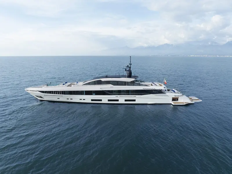 At anchor, the GranSport 54 shows the low freeboard and glazed superstructure Alberto Mancini drew for the line's fast-displacement profile.