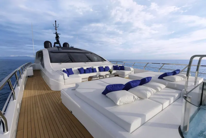 The foredeck sunpad on a Mangusta GranSport 54, part of the series' expanded outdoor living area over the Maxi Open range it succeeded.