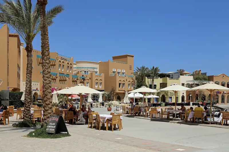Quayside tables filling up outside Seventh Star Restaurant, the marina's restaurant row doing the business it is best known for.