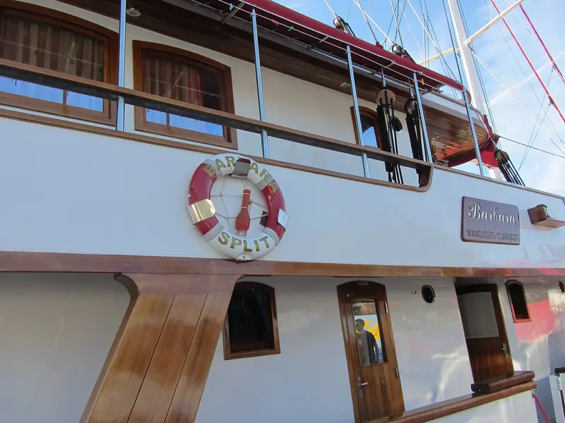 Split on the transom. The charter and small-ship fleet that works out of this harbour is a large part of the traffic the marina handles.