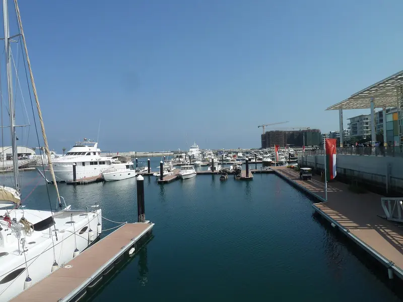 Al Mouj Marina, the basin cut into the development on the Muscat sea front. What you see is the whole of it: this is a resort marina, not a port.