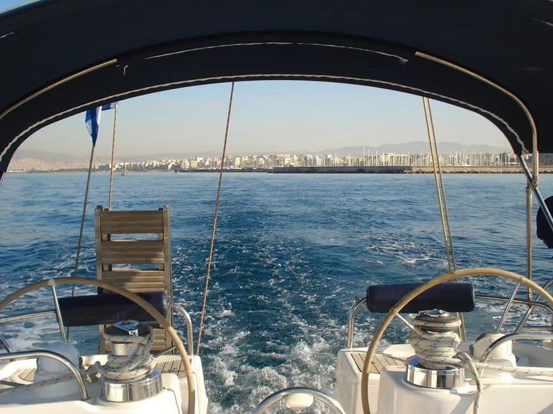 Looking back at the Kalamaki coastline from a yacht's helm seat just clear of the harbour entrance.