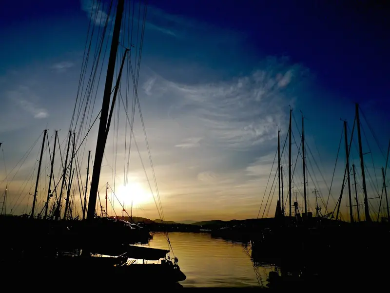 Sunset over the mast forest at Alimos Marina.