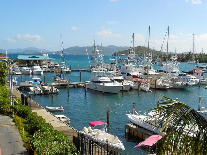 The marina basin at Red Hook, its floating docks packed with sport-fishing convertibles and cruising yachts under the fixed-dock arrangement American Yacht Harbor uses across its 123 berths.