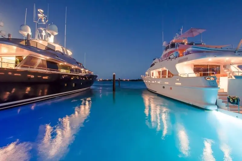 Two yachts berthed bow to bow at Blue Haven Marina in the evening