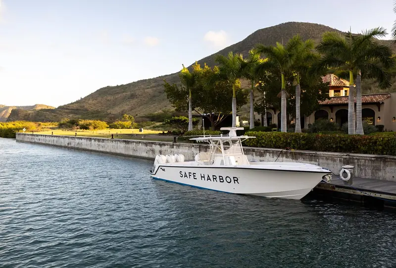 Yachts on anchor off the South East Peninsula, with Nevis and the strait known as The Narrows beyond.