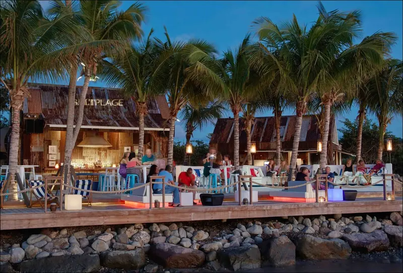 Salt Plage, the corrugated-steel beach bar and restaurant at Christophe Harbour, at dusk.