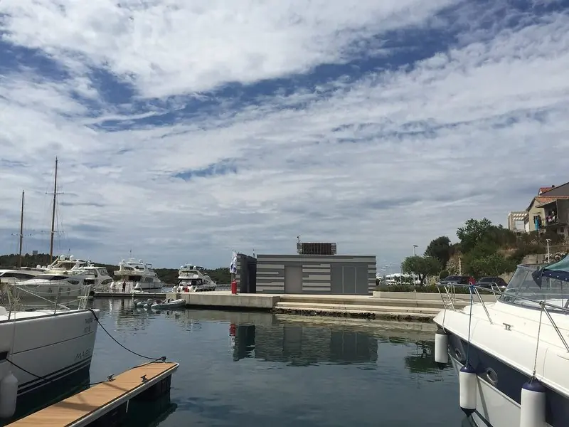 Motor boats take the inner pontoons in front of the marina service building, close enough that the walk from berth to office is a couple of minutes.