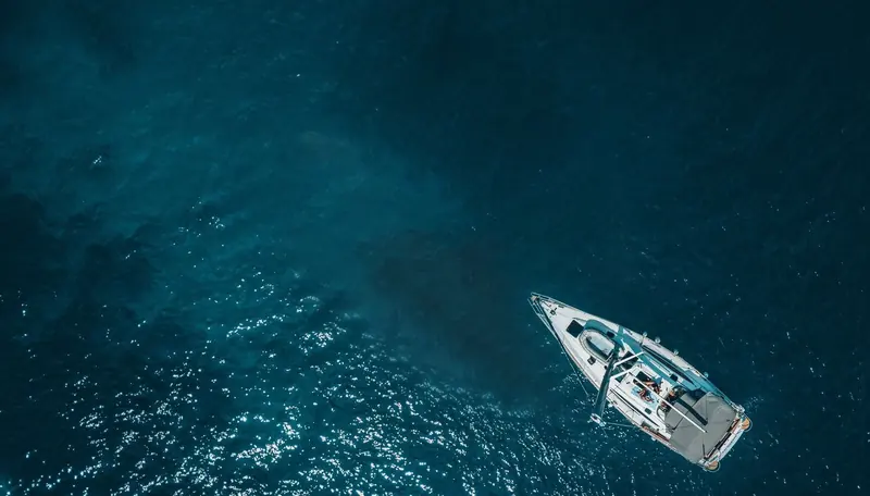 A yacht anchored off Denarau in the clear water the island is known for