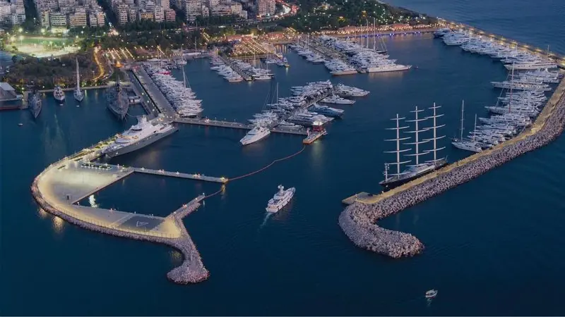 Flisvos from the air, breakwaters wrapped around a basin of finger pontoons on the Athens coast.